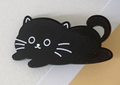 Hårklämma i form av en gullig svart katt