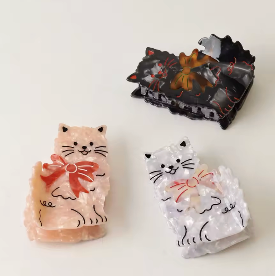 Hårklämma-katt med rosett, finns i två färger