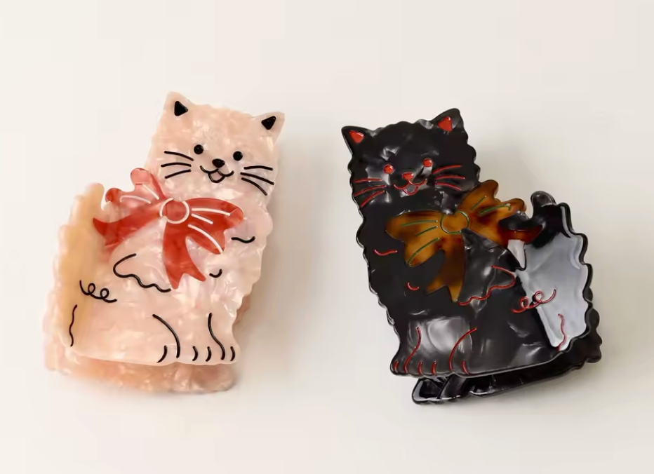 Hårklämma-katt med rosett, finns i två färger