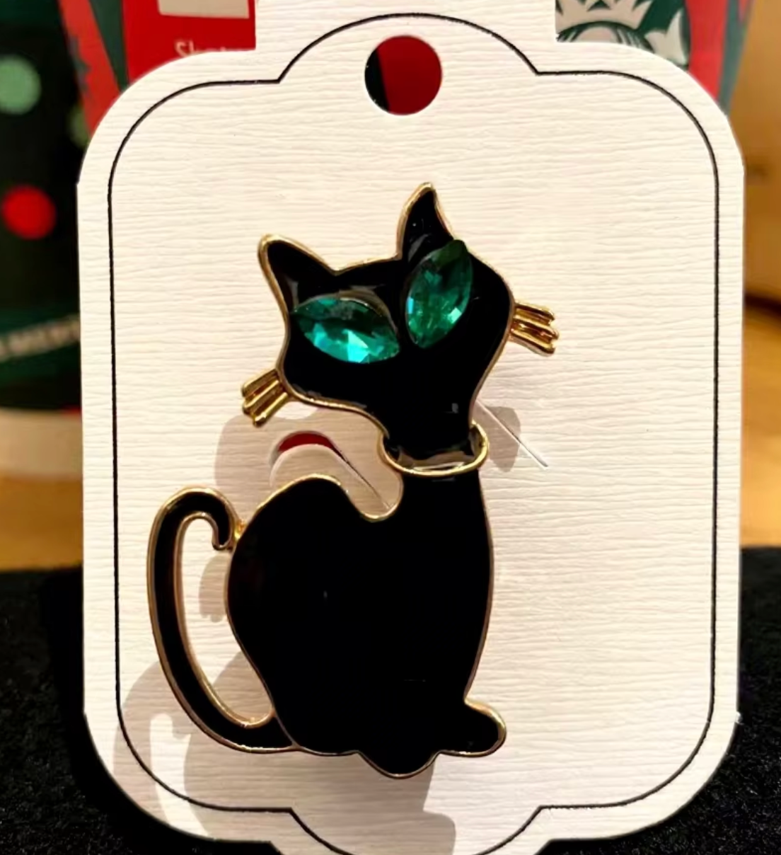 Brosch-svart katt