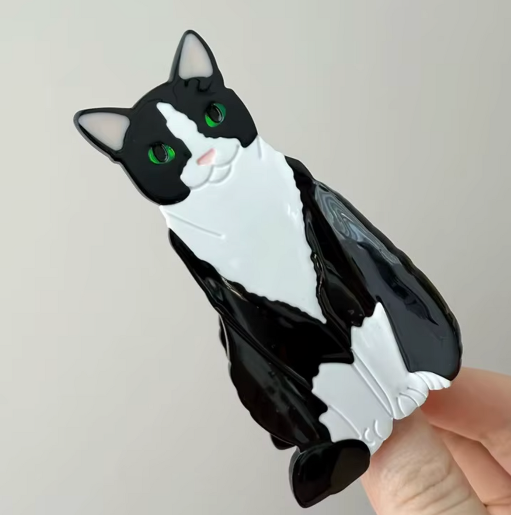 Hårklämma-sittande katt, finns i 4 olika varianter