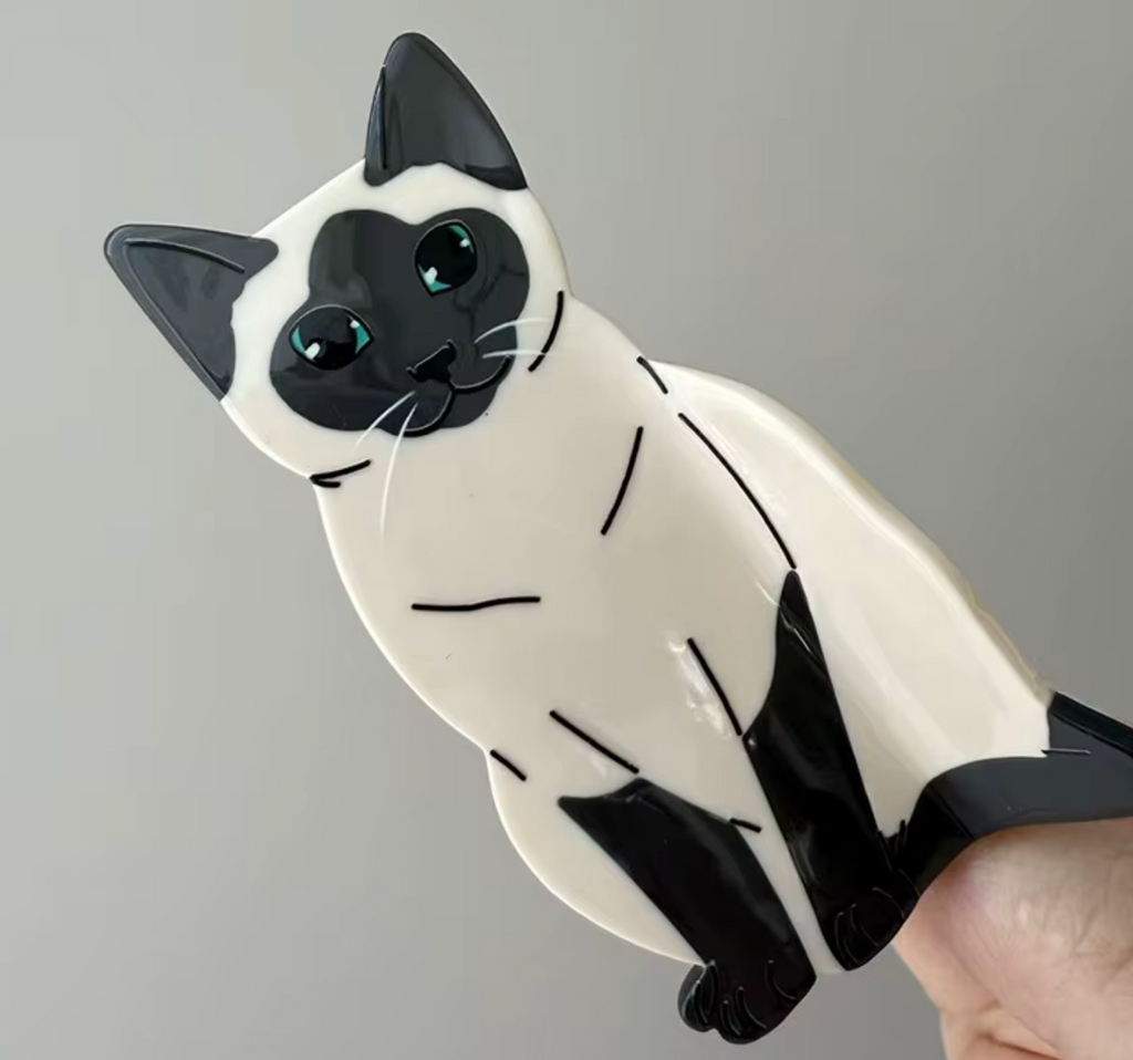 Hårklämma-sittande katt, finns i 4 olika varianter