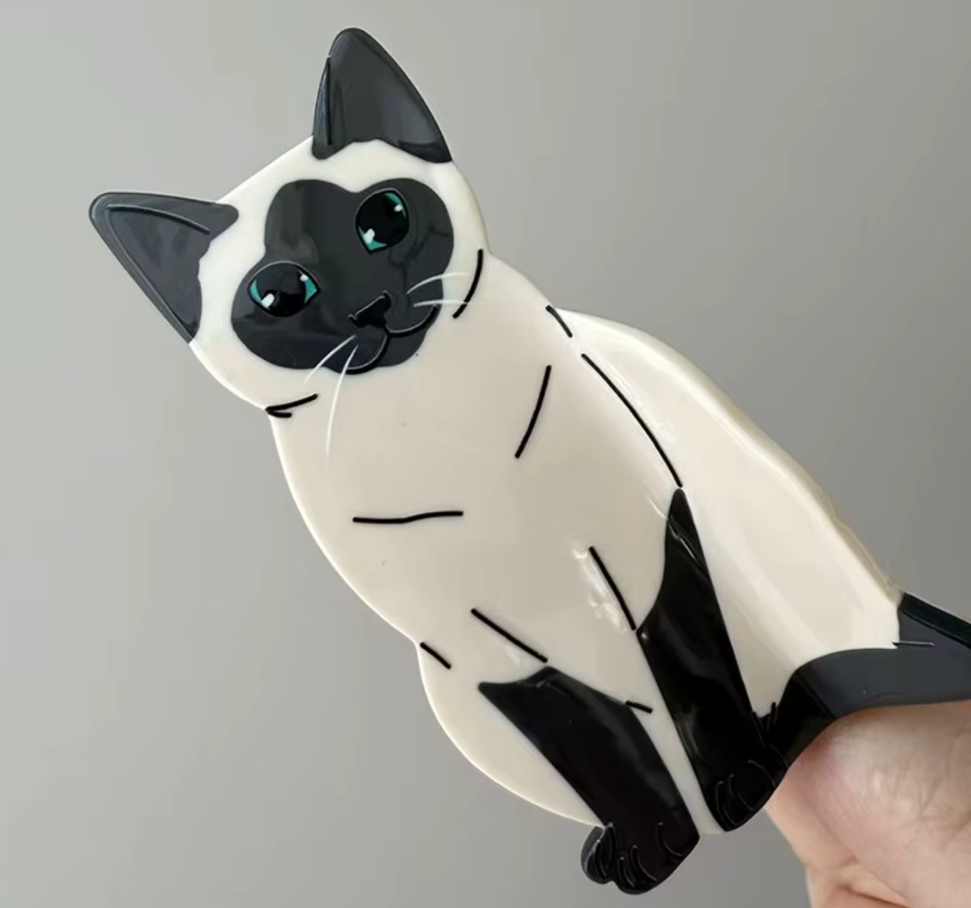 Hårklämma-sittande katt, finns i 4 olika varianter