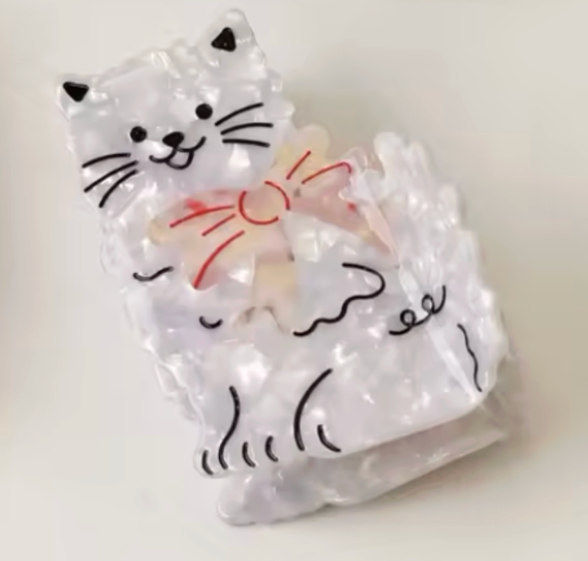 Hårklämma-katt med rosett, finns i två färger
